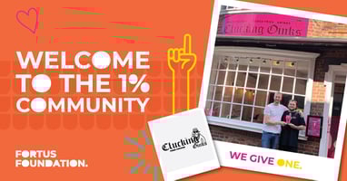 Clucking Oinks owner shaking hands with Head of Fortus Foundation to celebrate becoming a 1%er doner partner