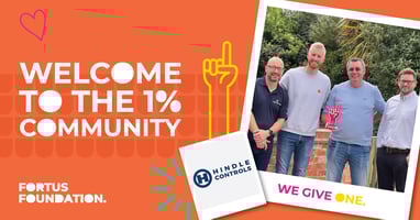 Harrisons Signs owner shaking hands with Head of Fortus Foundation to celebrate becoming a 1%er doner partner