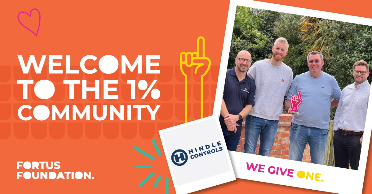 Harrisons Signs owner shaking hands with Head of Fortus Foundation to celebrate becoming a 1%er doner partner