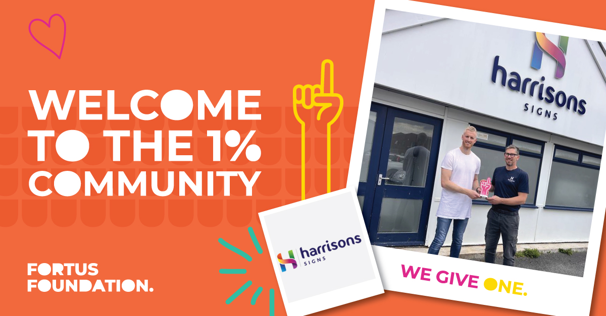 Harrisons Signs owner shaking hands with Head of Fortus Foundation to celebrate becoming a 1%er doner partner